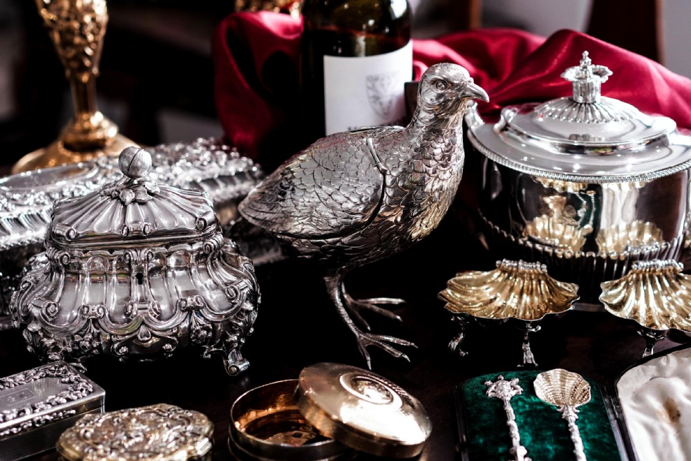 A pair of Georgian sterling silver salt cellars shaped like fluted scallop shells with gilt interiors. View XI