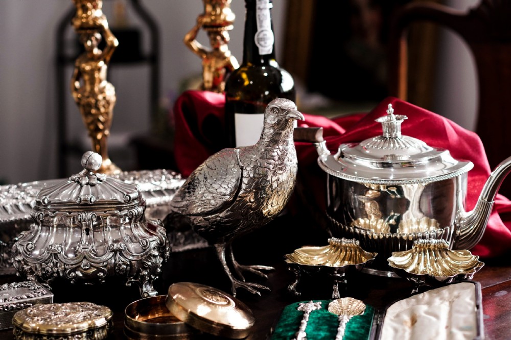 A pair of Georgian sterling silver salt cellars shaped like fluted scallop shells with gilt interiors. View XII