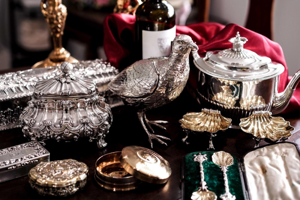 A pair of Georgian sterling silver salt cellars shaped like fluted scallop shells with gilt interiors. View XIII