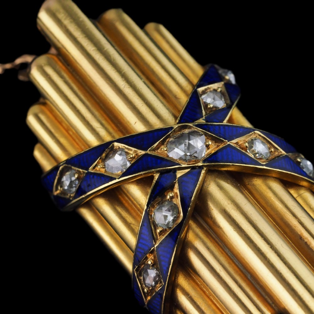 A Victorian 18K yellow gold pendant featuring vertical fluted bars encased by blue enamel cross-bands set with rose-cut diamonds. View IX