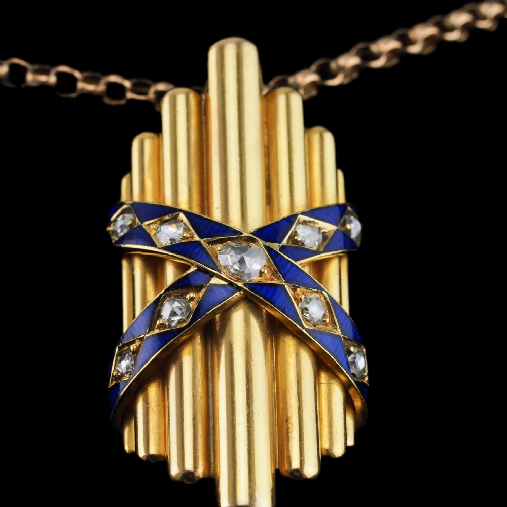 A Victorian 18K yellow gold pendant featuring vertical fluted bars encased by blue enamel cross-bands set with rose-cut diamonds. View X