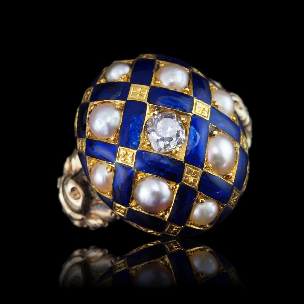 An antique Victorian 14K gold ring featuring a domed royal blue enamel lattice design accented with round pearls, star engravings, and a central diamond. View III