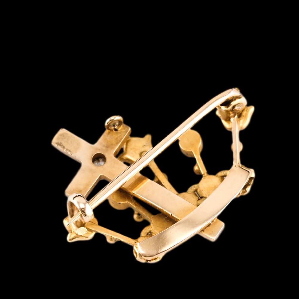 A late Victorian 15-carat gold coronet brooch set with natural pearls and a central cross motif adorned with a single diamond. View XVIII