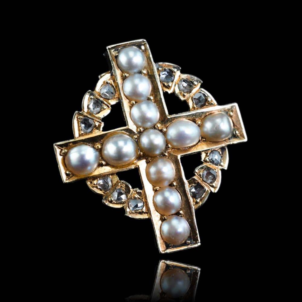 An antique 15K yellow gold Celtic cross brooch and pendant set with central pearls along the arms and diamonds set within the circular halo. View XI
