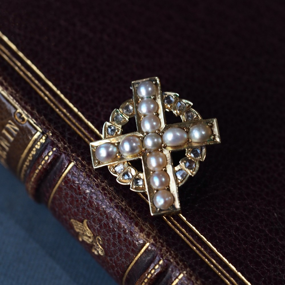 An antique 15K yellow gold Celtic cross brooch and pendant set with central pearls along the arms and diamonds set within the circular halo. View XIII