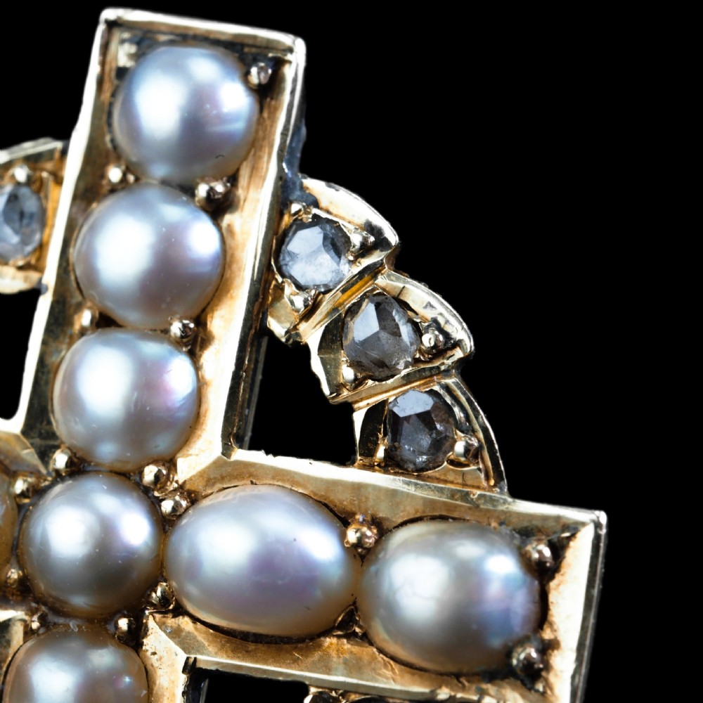 An antique 15K yellow gold Celtic cross brooch and pendant set with central pearls along the arms and diamonds set within the circular halo. View XV