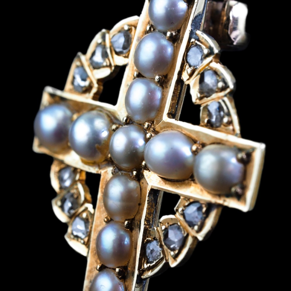An antique 15K yellow gold Celtic cross brooch and pendant set with central pearls along the arms and diamonds set within the circular halo. View XVI