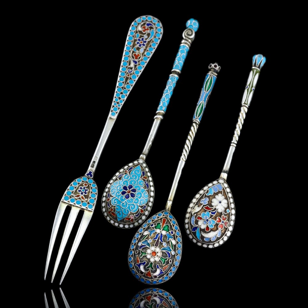 A four-piece set of late 19th-century Russian silver and cloisonne enamel cutlery featuring three spoons and a fork with turquoise blue, white, and red floral motifs. View VI