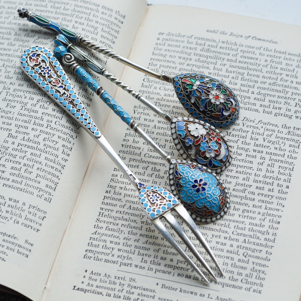 A four-piece set of late 19th-century Russian silver and cloisonne enamel cutlery featuring three spoons and a fork with turquoise blue, white, and red floral motifs. View XIII
