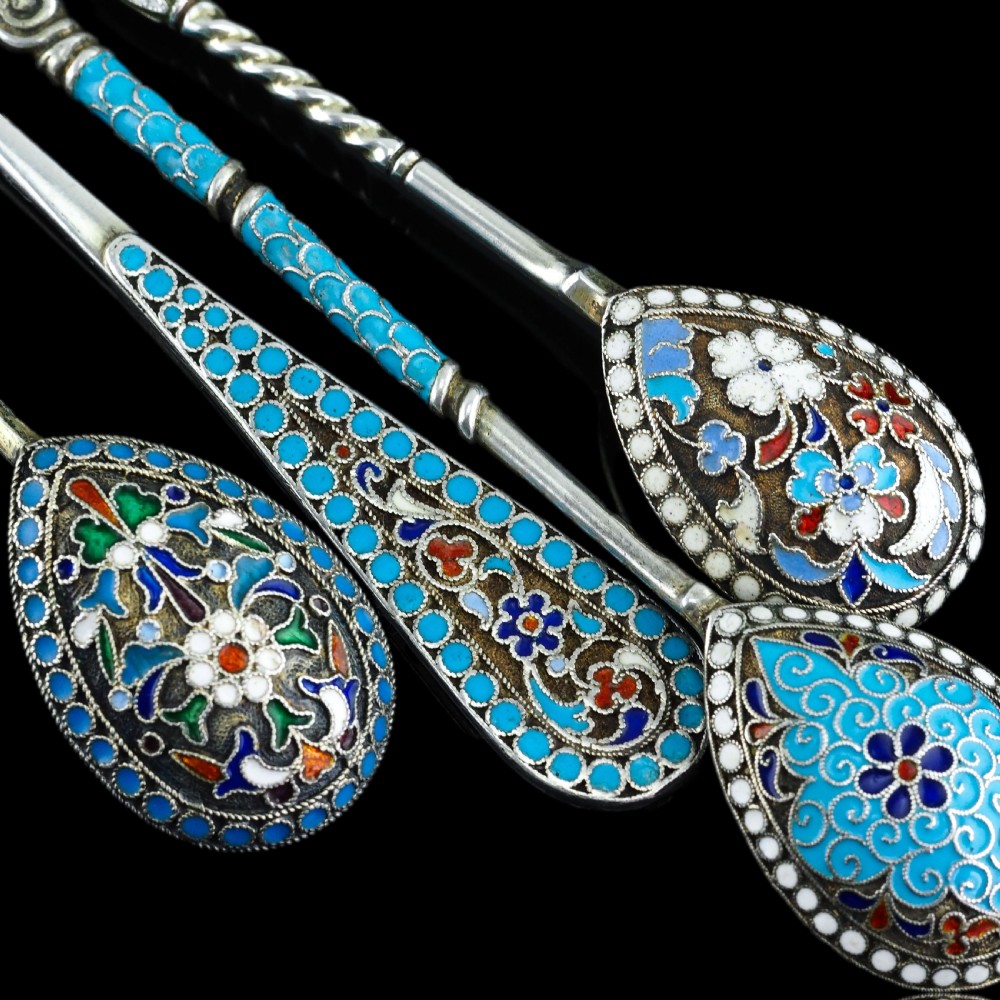 A four-piece set of late 19th-century Russian silver and cloisonne enamel cutlery featuring three spoons and a fork with turquoise blue, white, and red floral motifs. View XVI