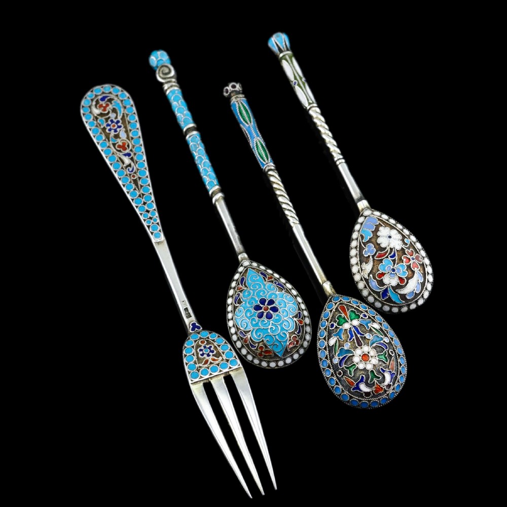 A four-piece set of late 19th-century Russian silver and cloisonne enamel cutlery featuring three spoons and a fork with turquoise blue, white, and red floral motifs. View XXI