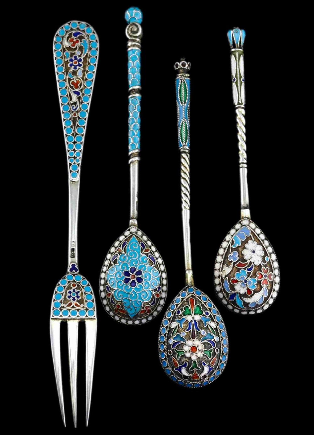 A four-piece set of late 19th-century Russian silver and cloisonne enamel cutlery featuring three spoons and a fork with turquoise blue, white, and red floral motifs.