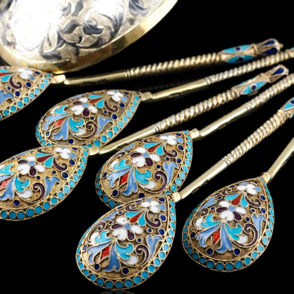 Set of six antique Russian silver gilt spoons featuring blue, red, and white cloisonne enamel scrollwork on the backs of the teardrop-shaped bowls. View X