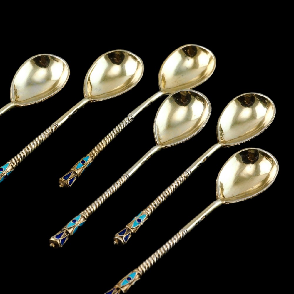Set of six antique Russian silver gilt spoons featuring blue, red, and white cloisonne enamel scrollwork on the backs of the teardrop-shaped bowls. View XIII