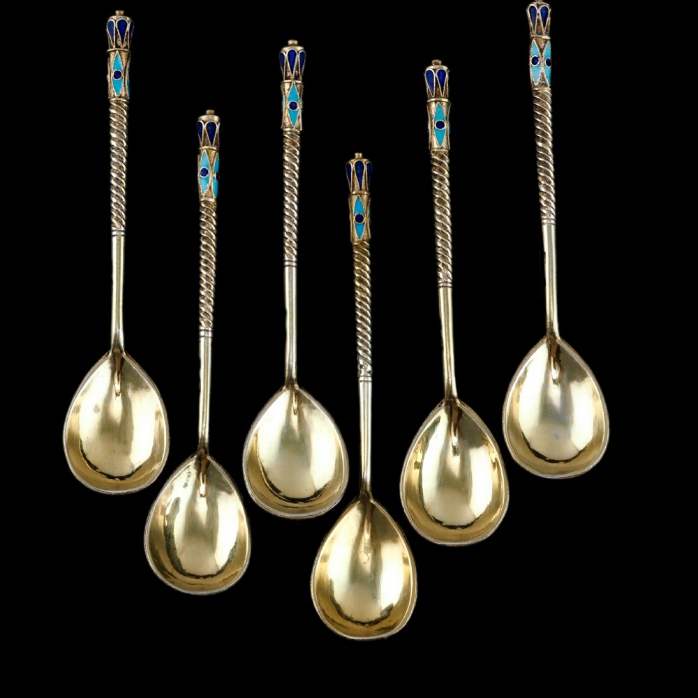 Set of six antique Russian silver gilt spoons featuring blue, red, and white cloisonne enamel scrollwork on the backs of the teardrop-shaped bowls. View XIV
