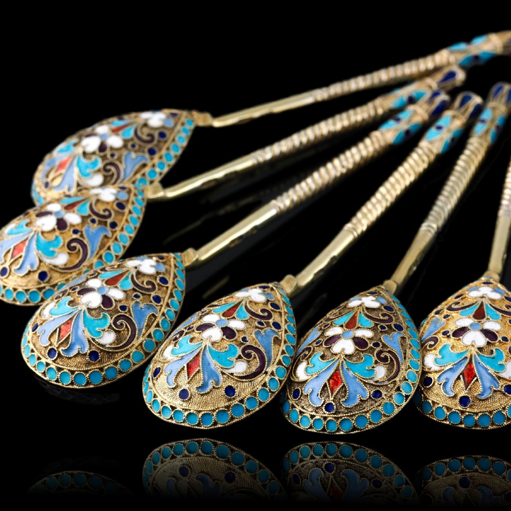 Set of six antique Russian silver gilt spoons featuring blue, red, and white cloisonne enamel scrollwork on the backs of the teardrop-shaped bowls. View XV