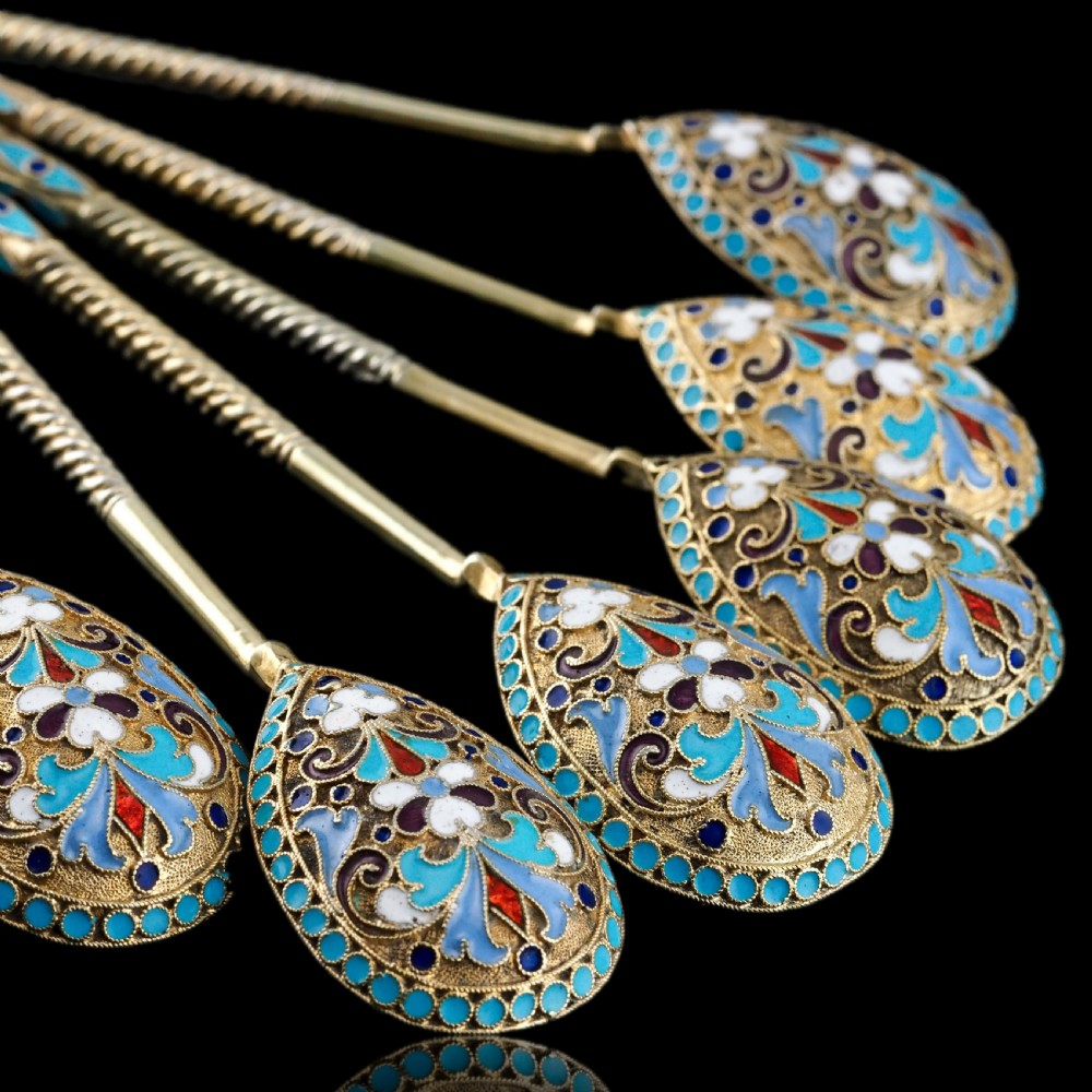 Set of six antique Russian silver gilt spoons featuring blue, red, and white cloisonne enamel scrollwork on the backs of the teardrop-shaped bowls. View XVII