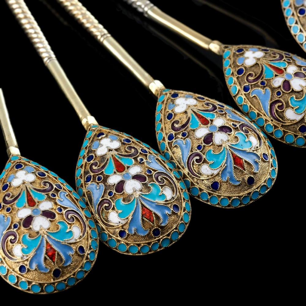 Set of six antique Russian silver gilt spoons featuring blue, red, and white cloisonne enamel scrollwork on the backs of the teardrop-shaped bowls. View XXIII