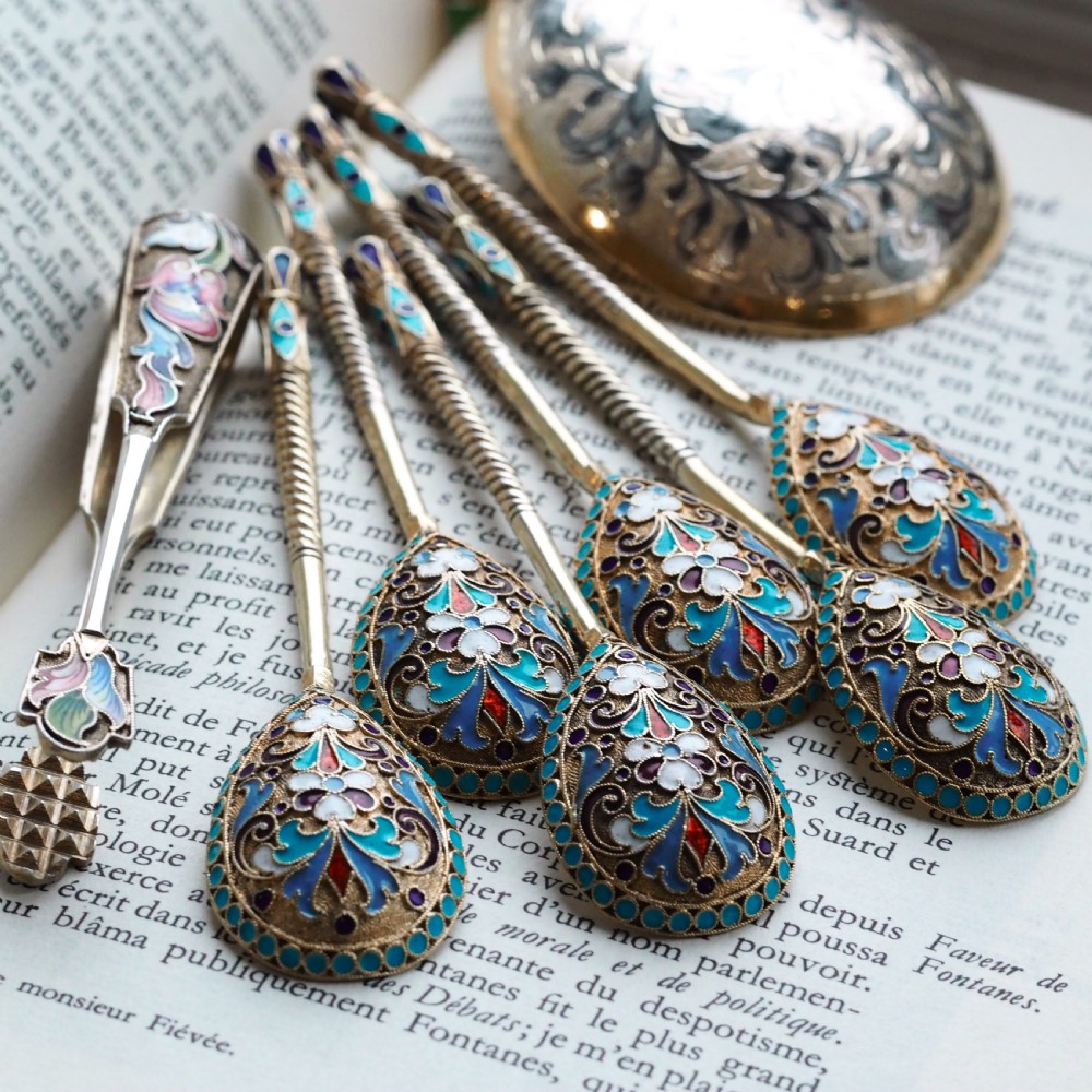 Set of six antique Russian silver gilt spoons featuring blue, red, and white cloisonne enamel scrollwork on the backs of the teardrop-shaped bowls. View XXV