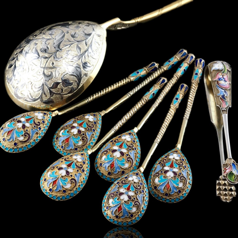 An antique Russian silver-gilt serving spoon featuring intricate black niello foliate engraving across the back of the oval bowl and a turned stem. View XI