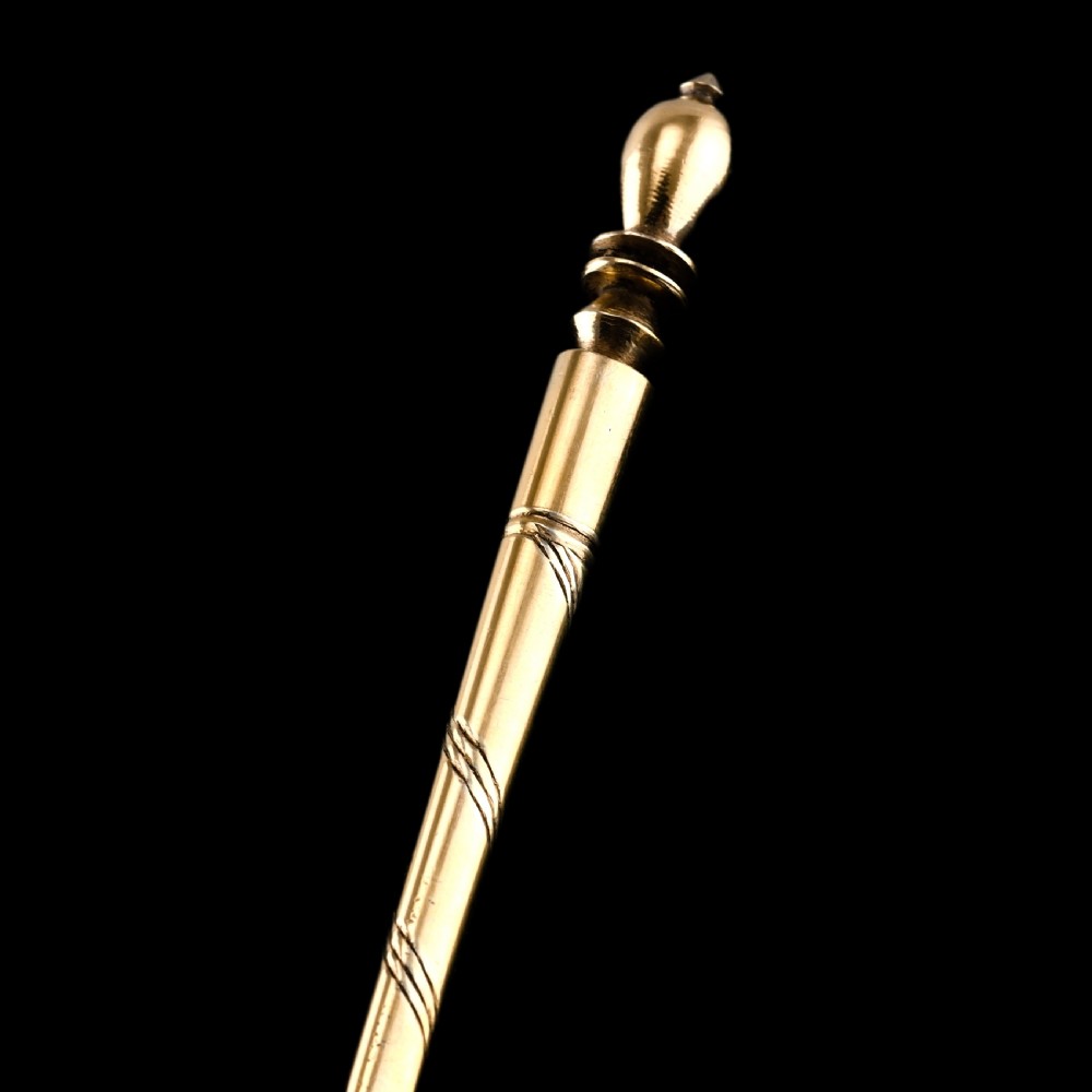 An antique Russian silver-gilt serving spoon featuring intricate black niello foliate engraving across the back of the oval bowl and a turned stem. View XIII