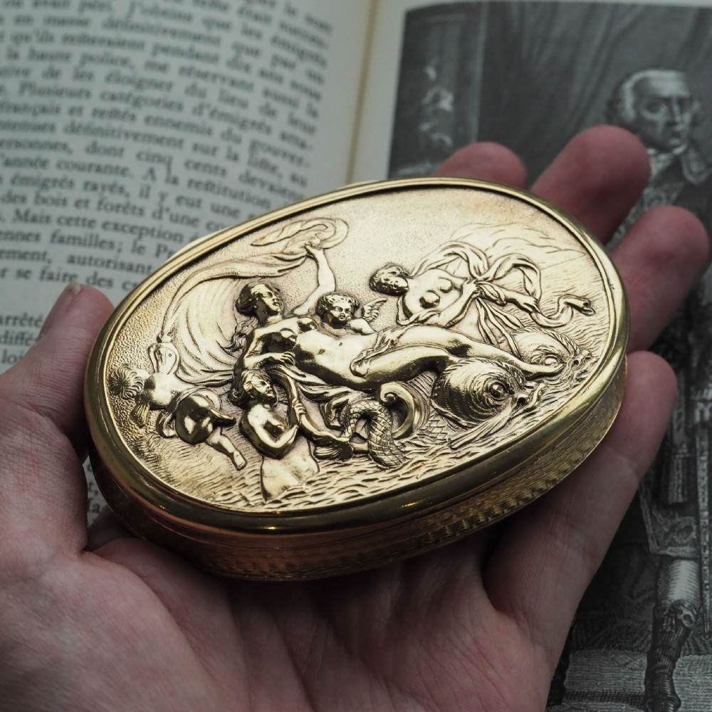 An oval Georgian silver-gilt snuff box featuring a relief scene of Venus surrounded by attendants and sea creatures on the lid. View IX