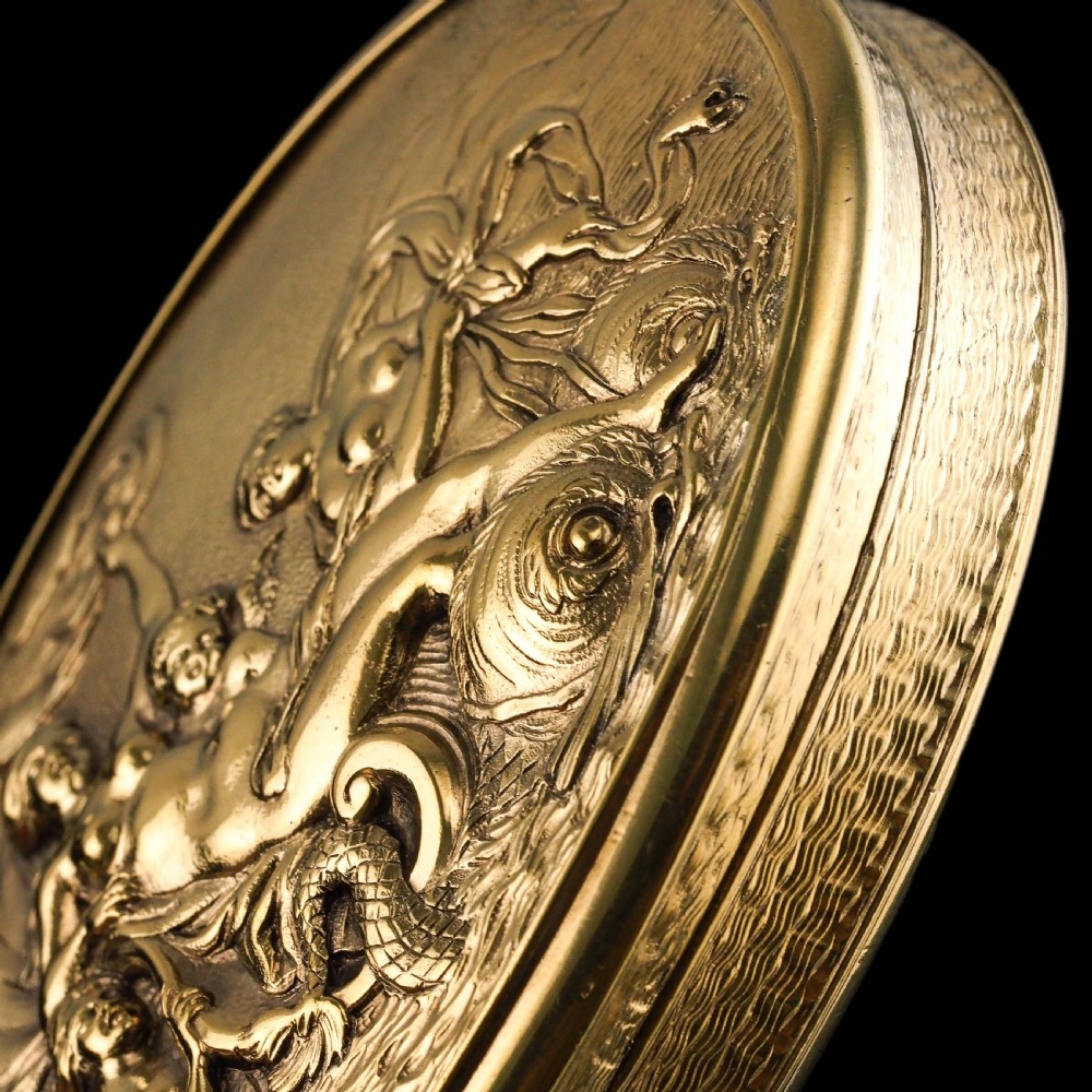 An oval Georgian silver-gilt snuff box featuring a relief scene of Venus surrounded by attendants and sea creatures on the lid. View XV