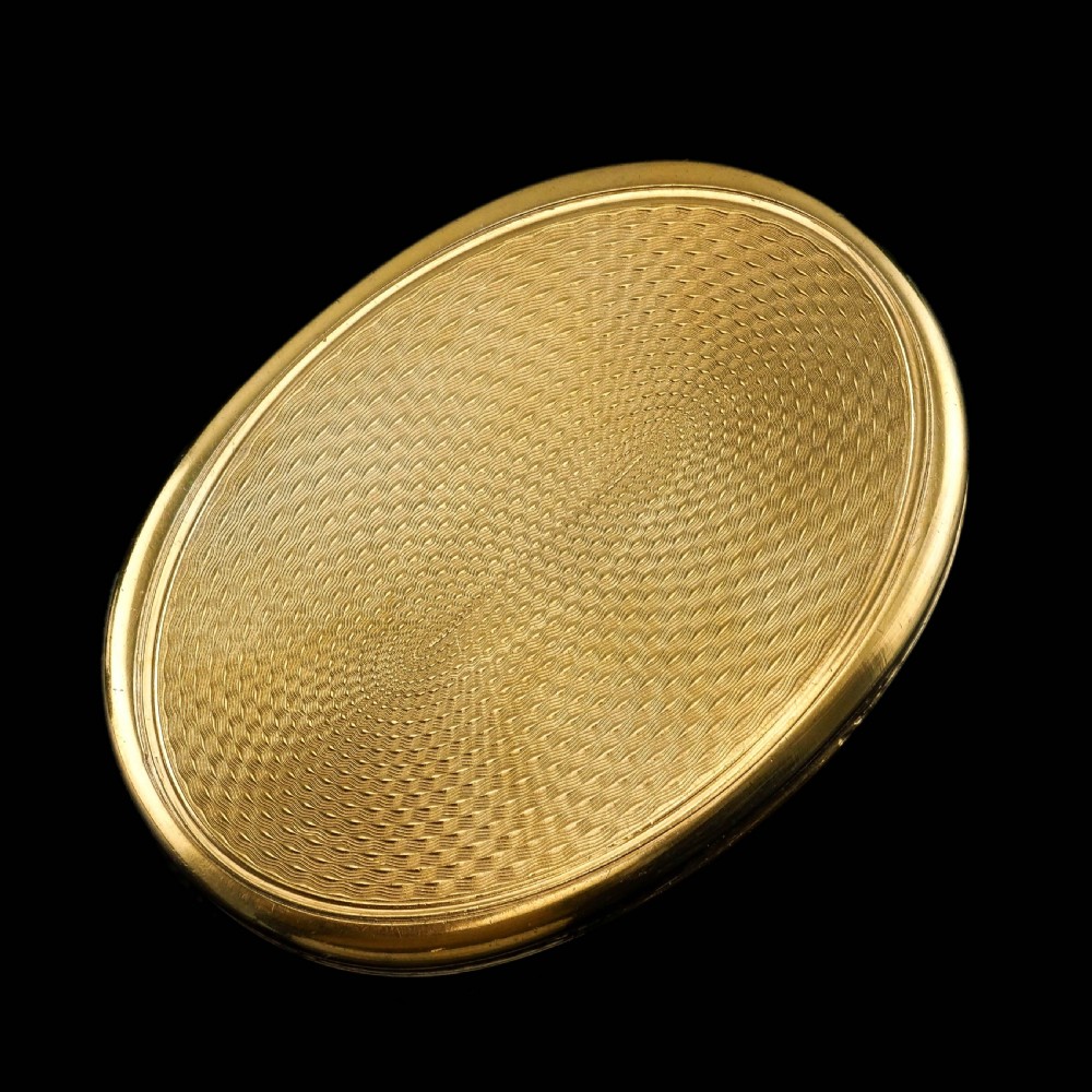 An oval Georgian silver-gilt snuff box featuring a relief scene of Venus surrounded by attendants and sea creatures on the lid. View XVII