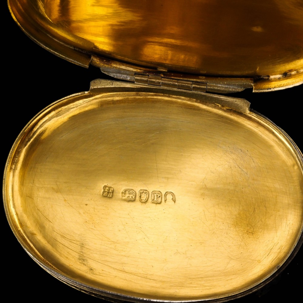 An oval Georgian silver-gilt snuff box featuring a relief scene of Venus surrounded by attendants and sea creatures on the lid. View XVIII