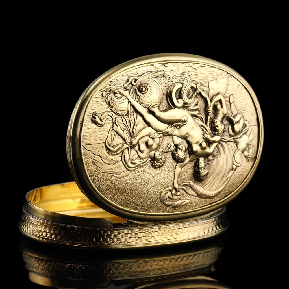 An oval Georgian silver-gilt snuff box featuring a relief scene of Venus surrounded by attendants and sea creatures on the lid. View XX