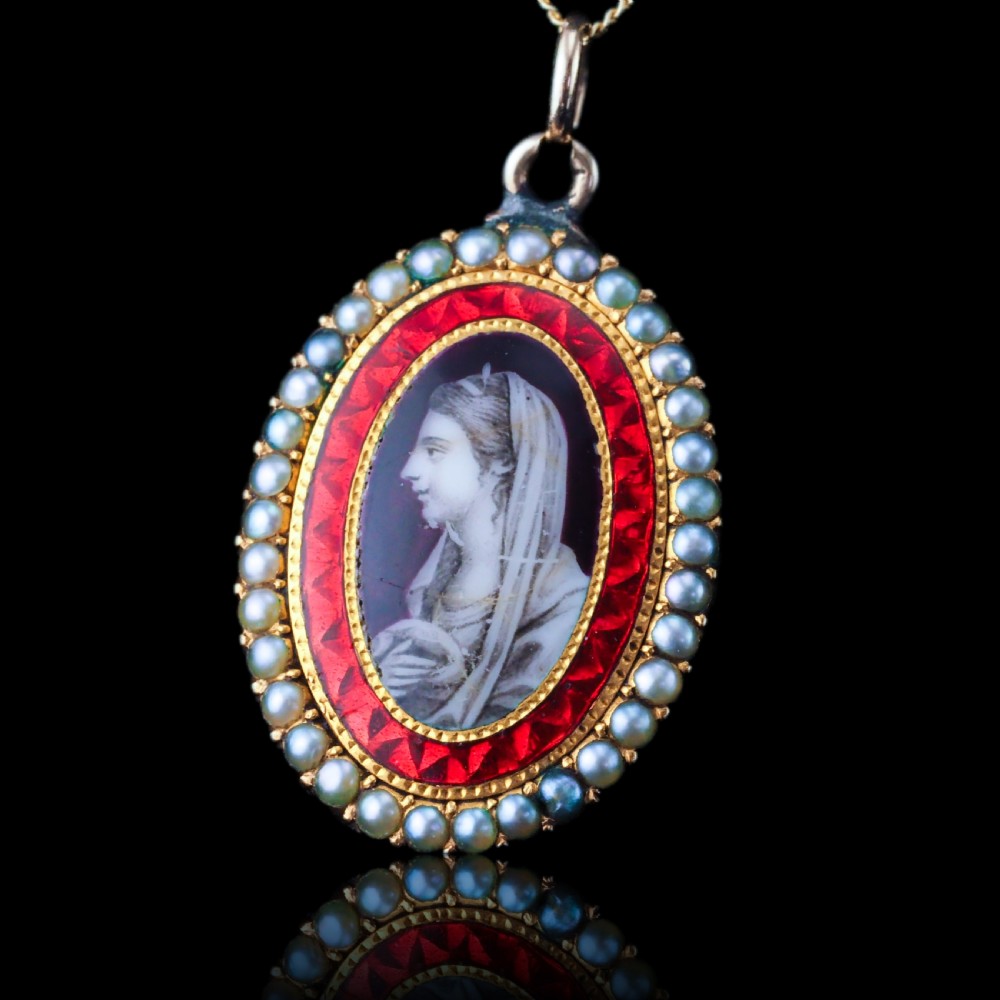 An oval Georgian gold pendant featuring a sepia miniature profile portrait surrounded by a red enamel border and a frame of seed pearls on a fine gold chain. View II