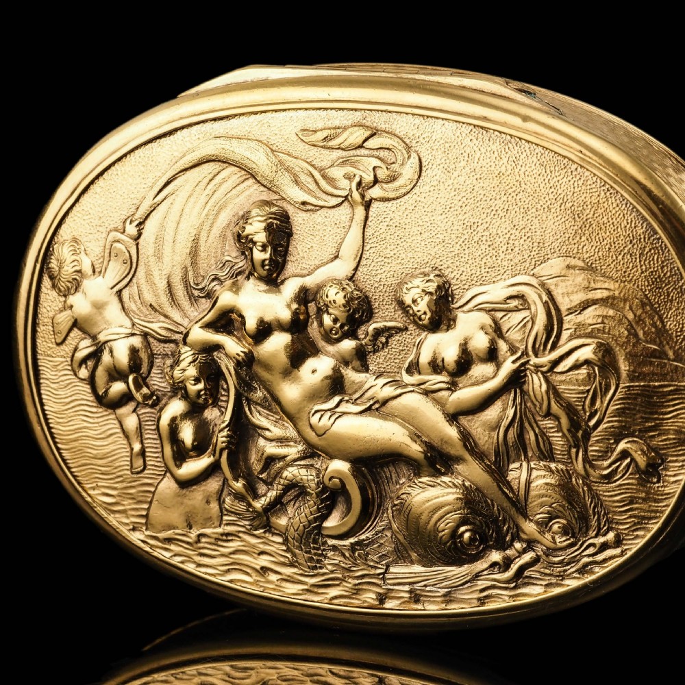 An oval Georgian silver-gilt snuff box featuring a detailed relief depicting Venus surrounded by attendants and cherubs on a textured ground. View III