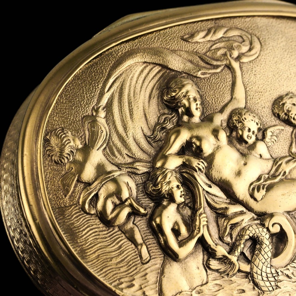 An oval Georgian silver-gilt snuff box featuring a detailed relief depicting Venus surrounded by attendants and cherubs on a textured ground. View XII