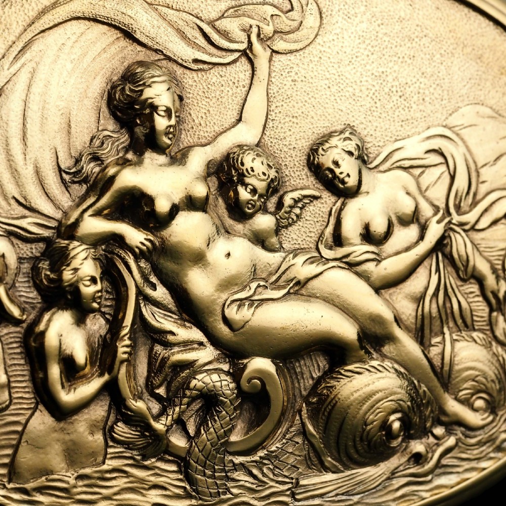An oval Georgian silver-gilt snuff box featuring a detailed relief depicting Venus surrounded by attendants and cherubs on a textured ground. View XVI