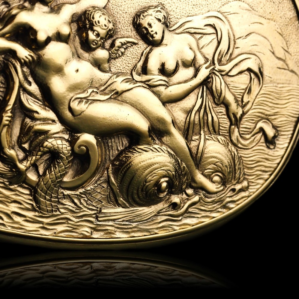 An oval Georgian silver-gilt snuff box featuring a detailed relief depicting Venus surrounded by attendants and cherubs on a textured ground. View XVII