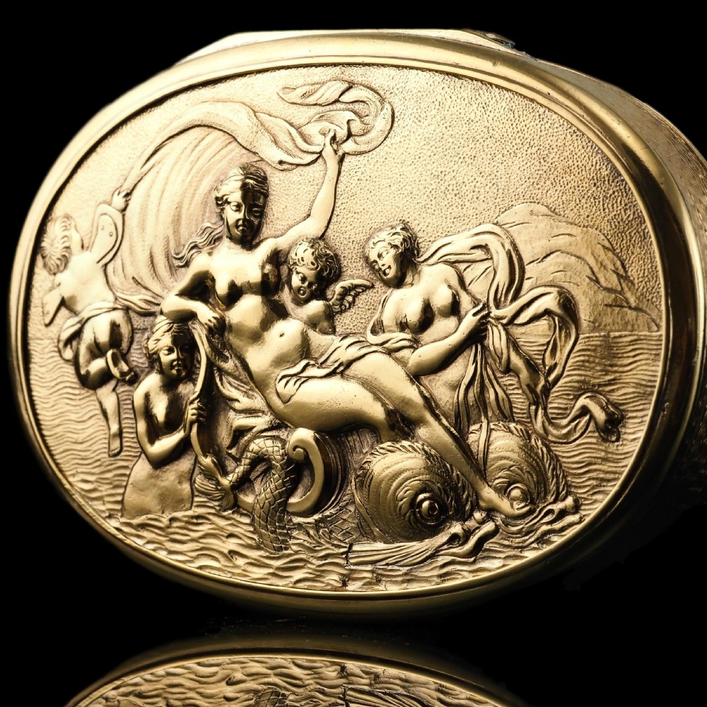 An oval Georgian silver-gilt snuff box featuring a detailed relief depicting Venus surrounded by attendants and cherubs on a textured ground. View XIX