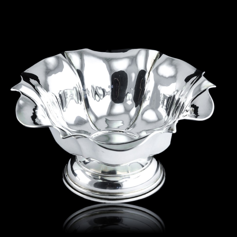 An antique Austro-Hungarian solid silver bowl featuring a flared, scalloped rim reminiscent of a floral blossom with a polished reflective finish. View II