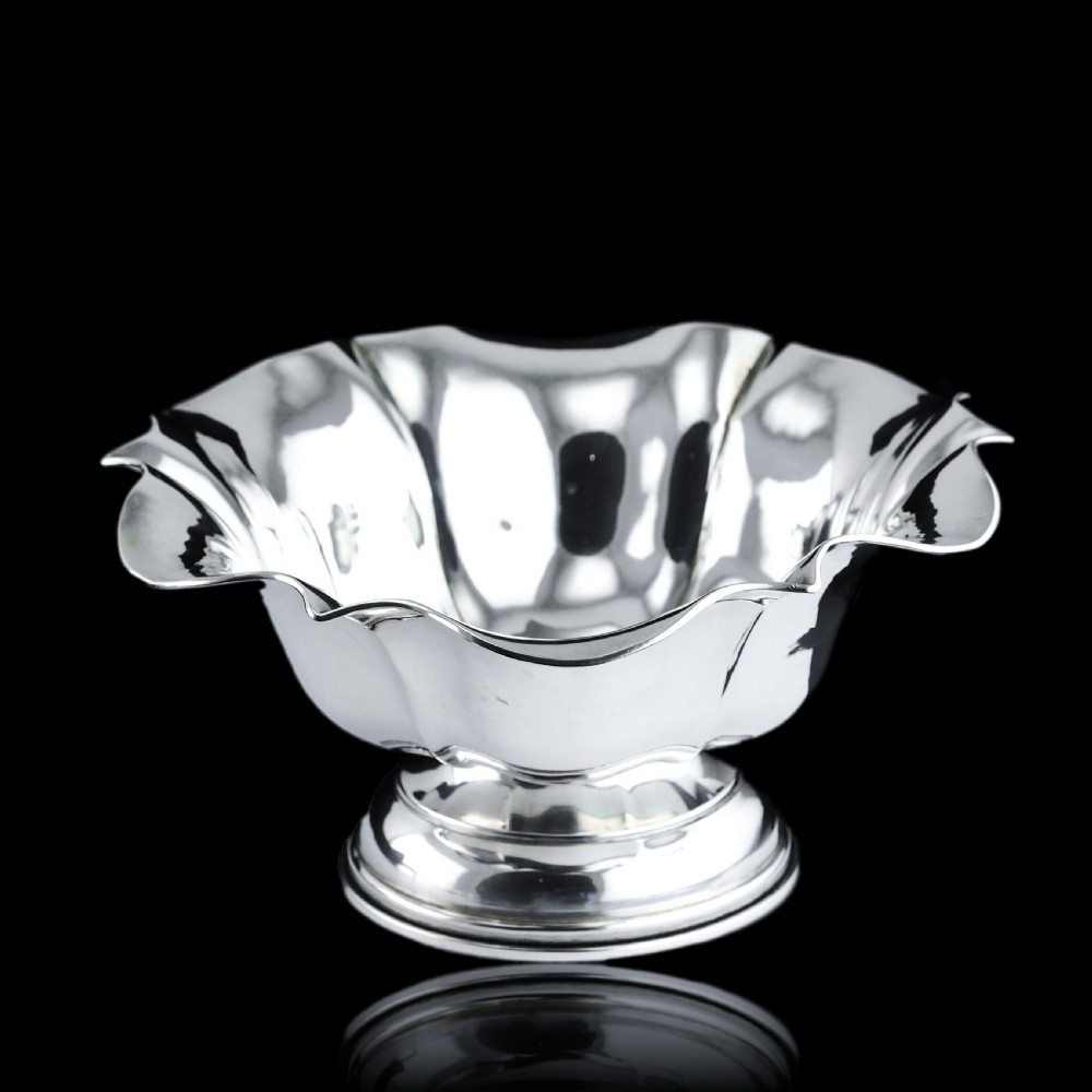 An antique Austro-Hungarian solid silver bowl featuring a flared, scalloped rim reminiscent of a floral blossom with a polished reflective finish. View III