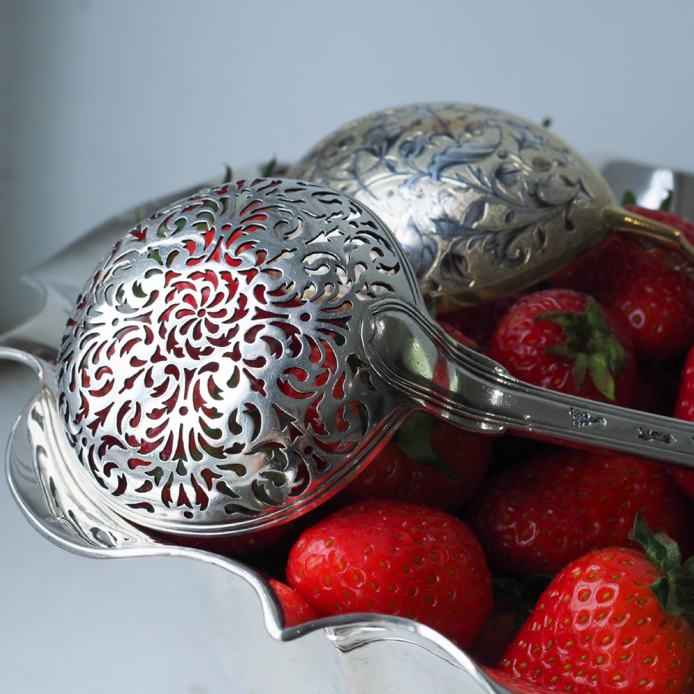An antique Austro-Hungarian solid silver bowl featuring a flared, scalloped rim reminiscent of a floral blossom with a polished reflective finish. View X