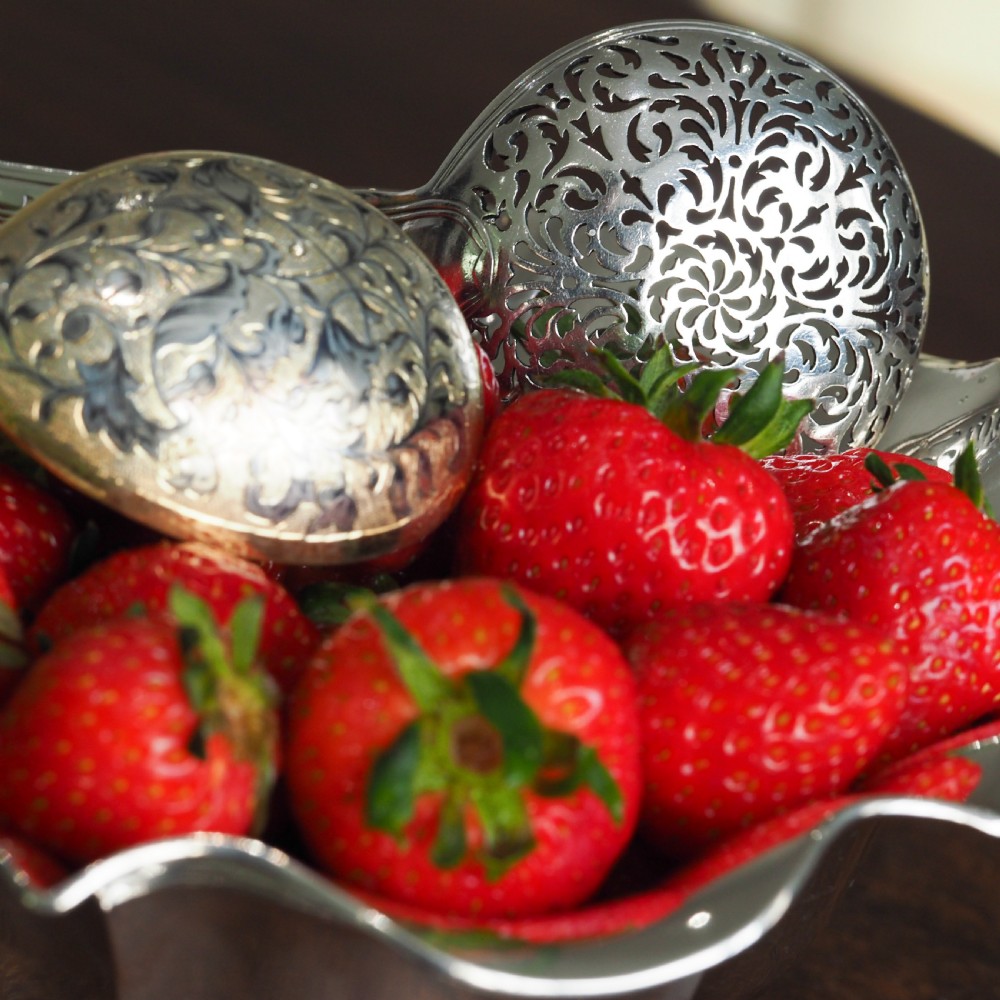 An antique Austro-Hungarian solid silver bowl featuring a flared, scalloped rim reminiscent of a floral blossom with a polished reflective finish. View XII