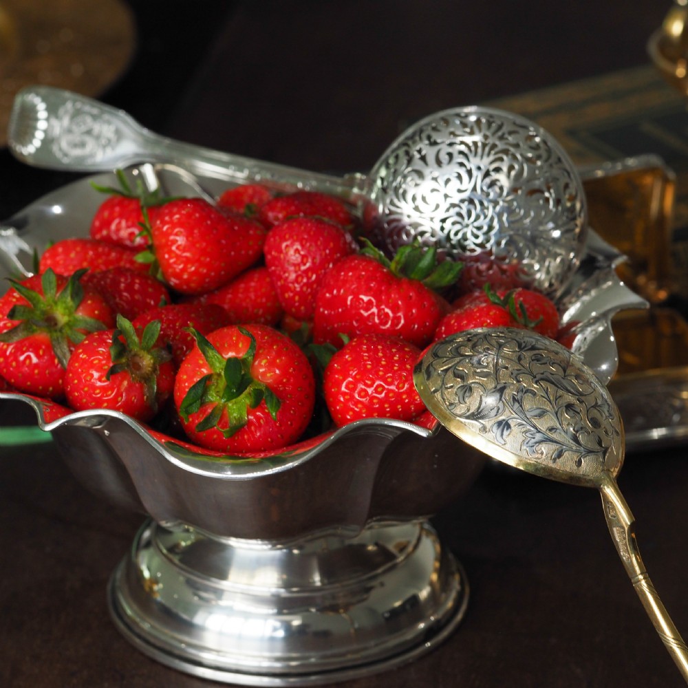 An antique Austro-Hungarian solid silver bowl featuring a flared, scalloped rim reminiscent of a floral blossom with a polished reflective finish. View XVI