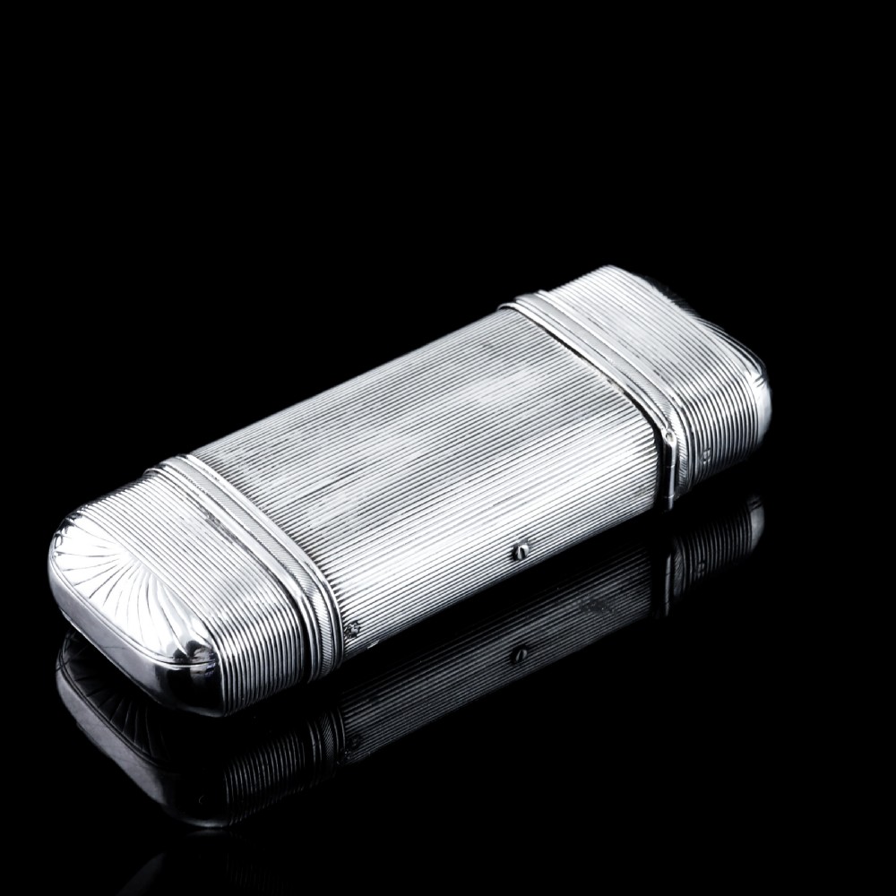 A 19th-century Dutch solid silver cigar case featuring a reeded linear texture and rounded ends with fan-shaped engraving. View IV