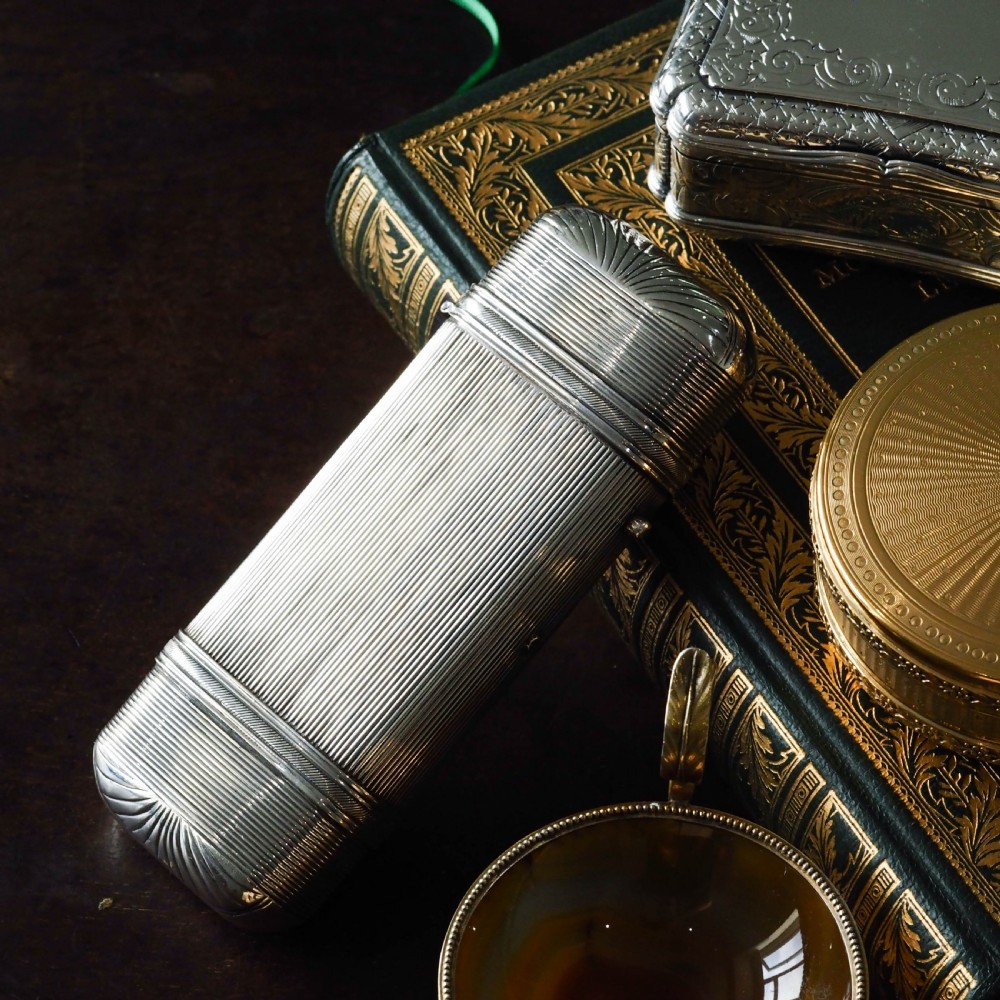 A 19th-century Dutch solid silver cigar case featuring a reeded linear texture and rounded ends with fan-shaped engraving. View IX