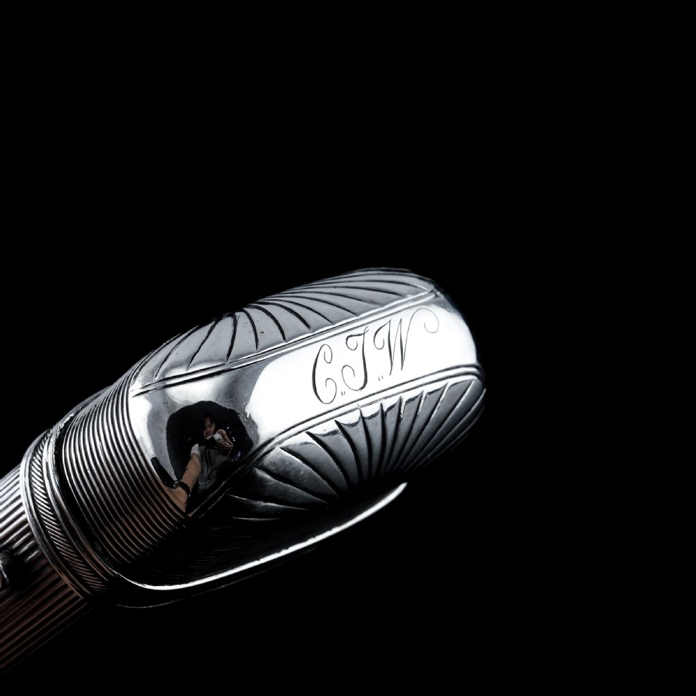 A 19th-century Dutch solid silver cigar case featuring a reeded linear texture and rounded ends with fan-shaped engraving. View XIII
