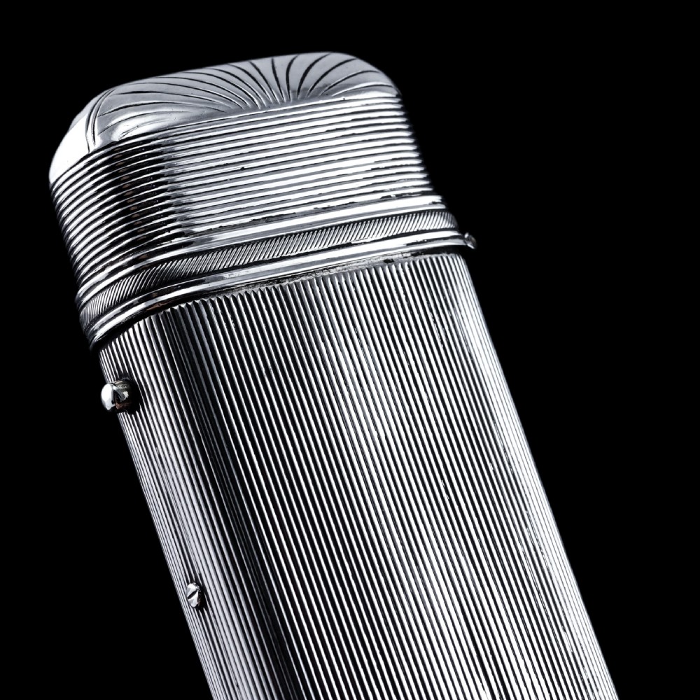 A 19th-century Dutch solid silver cigar case featuring a reeded linear texture and rounded ends with fan-shaped engraving. View XIV
