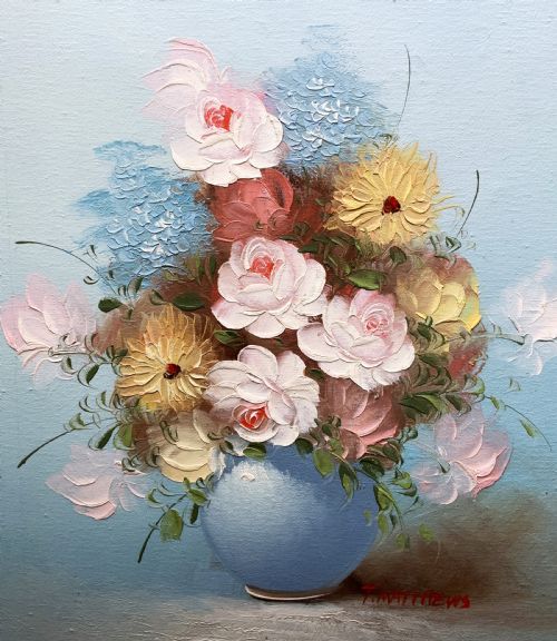fig 2. A framed post-war floral still life oil painting depicting pink, yellow, and blue flowers in a rounded blue vase within a gilt wooden frame.