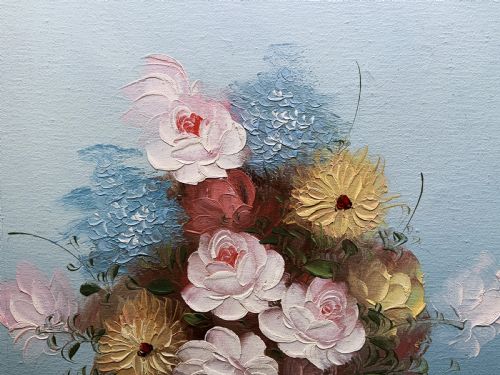 fig 4. A framed post-war floral still life oil painting depicting pink, yellow, and blue flowers in a rounded blue vase within a gilt wooden frame.