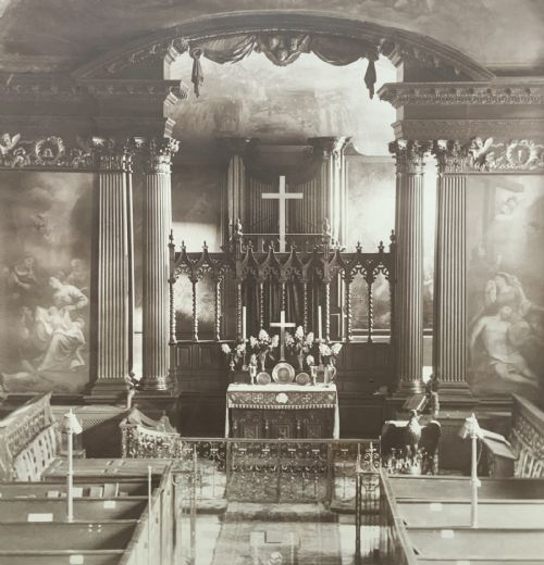 fig 4. A 1921 sepia photograph depicting a church altar and choir, mounted in a moulded dark oak frame with an engraved metal presentation plaque along the bottom edge.