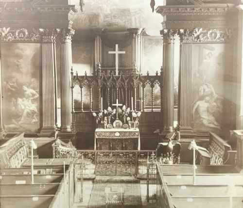 fig 5. A 1921 sepia photograph depicting a church altar and choir, mounted in a moulded dark oak frame with an engraved metal presentation plaque along the bottom edge.