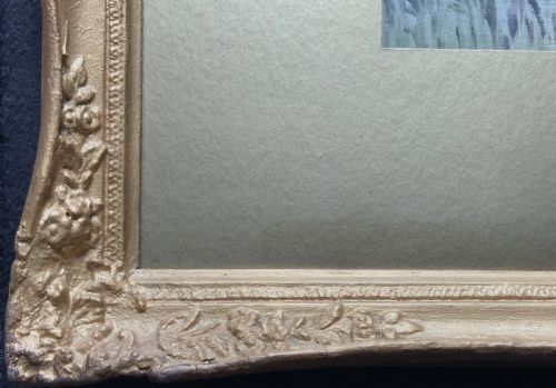 fig 3. A horizontal Victorian watercolour painting depicting a woodland river scene with a leaning tree, set within a gold mount and ornate gilt frame.